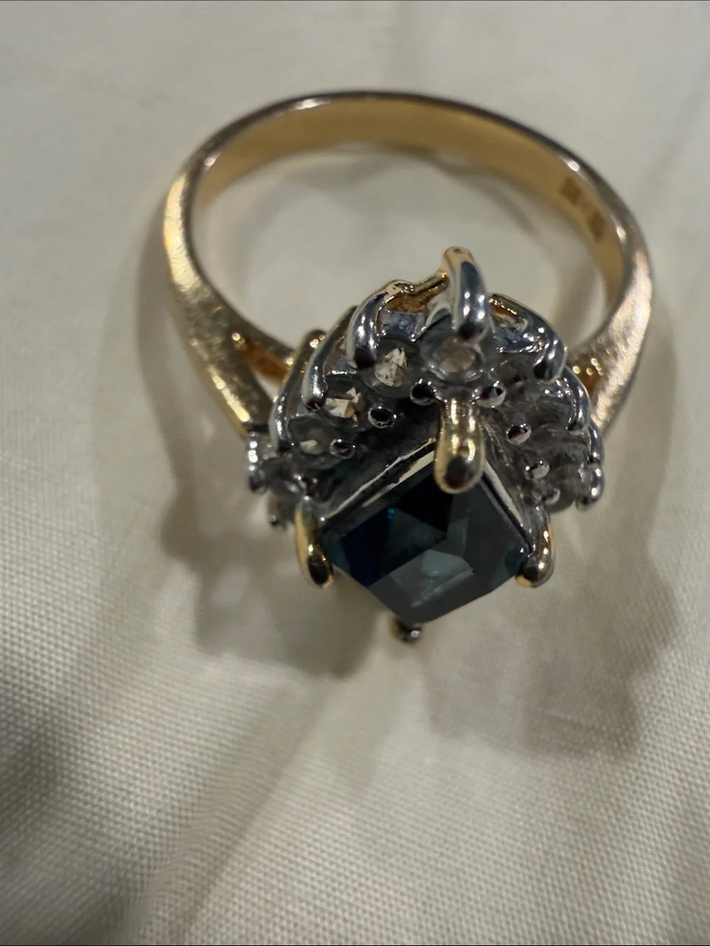 18K Gold Electroplated Ring with Deep Blue Kite-Cut Center and Clear Stones.